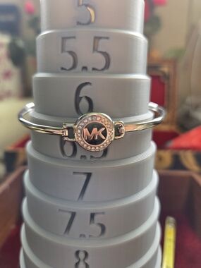 Michael Kors Silver Tone MK Logo Crystal Accent Bangle Bracelet